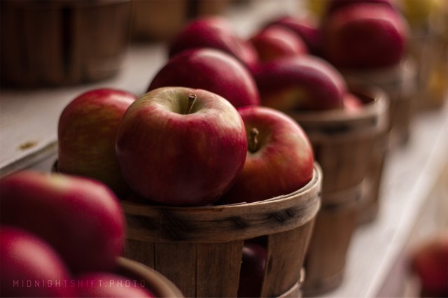 Apples sitting in a basket during autumn in Massachusetts.